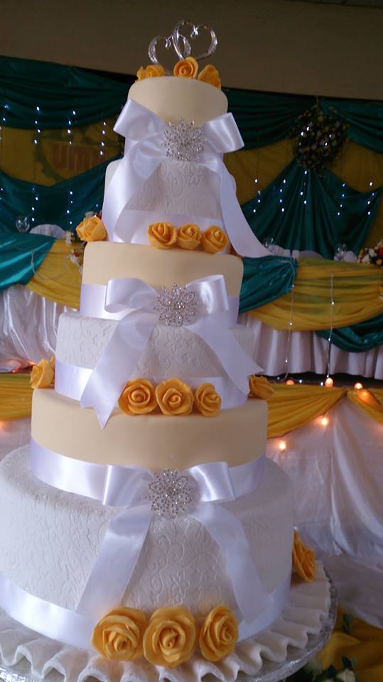 A six tier wedding cake by Real Cakes Uganda