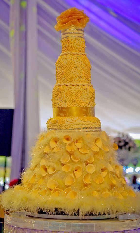 A beautiful golden yellow cake by Real Cakes Uganda