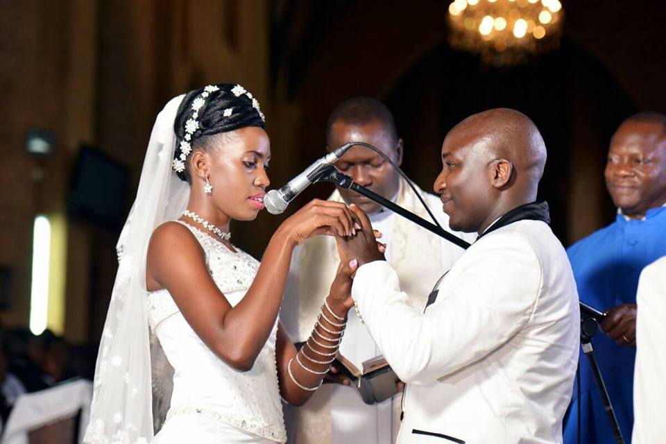 A bride and groom exchanging their Namirembe Cathedral