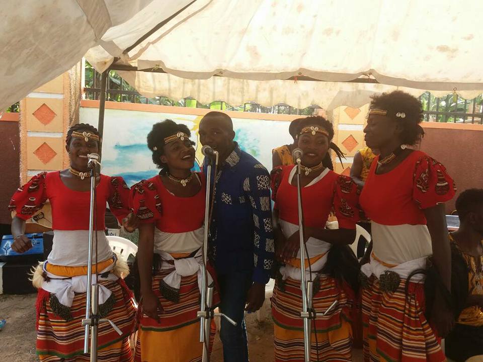 Ladies from Nyange Cultural Performers sing at Regina's introduction