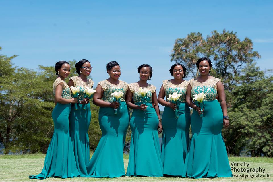 Beautiful bridesmaids cloaked in long cyan dresses, photo by Varsity Digital WORLD