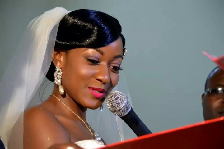 A bride saying her vows in church, makeup & salon done by Salon lords and ladys