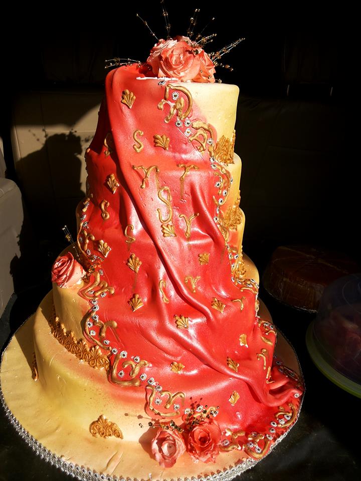 A red wedding cake baked by NHK Home Bakery