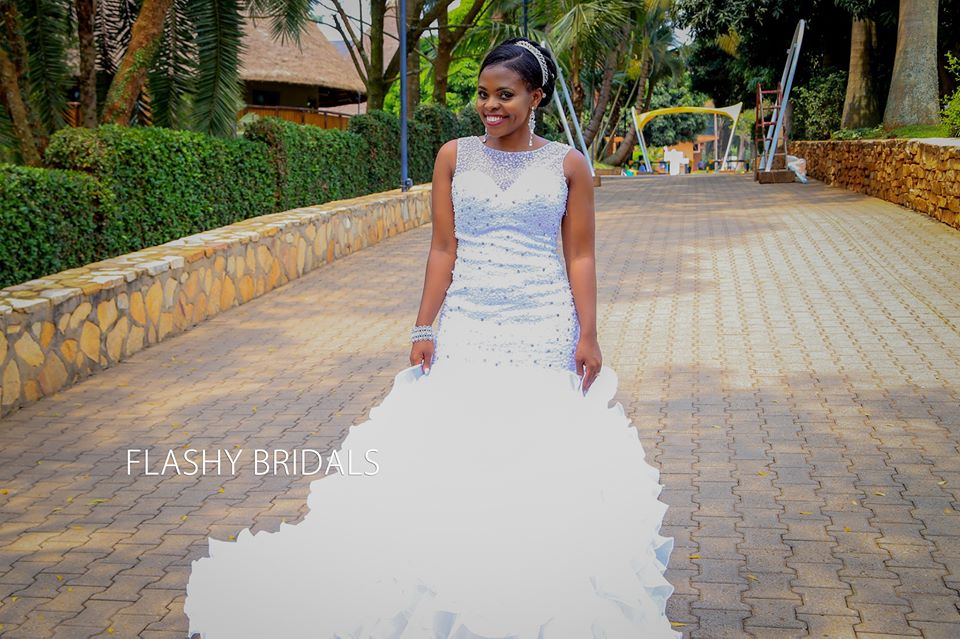 A beautiful bride clad in a sleeveless fitting mermaid gown by Flashy Bridals