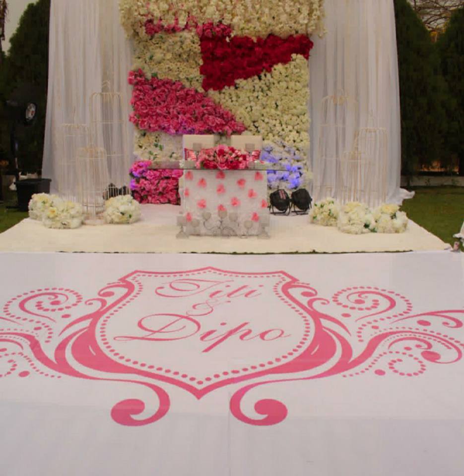 Simple wedding high table decorations by Enrova Events