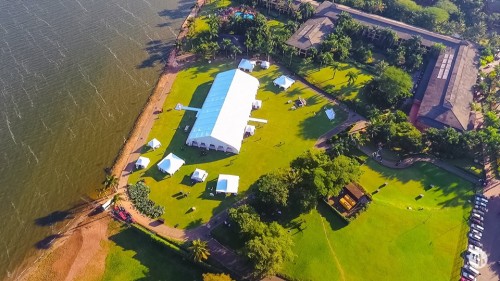 A drone photo of a Lakeside wedding reception at Speke Resort Munyonyo