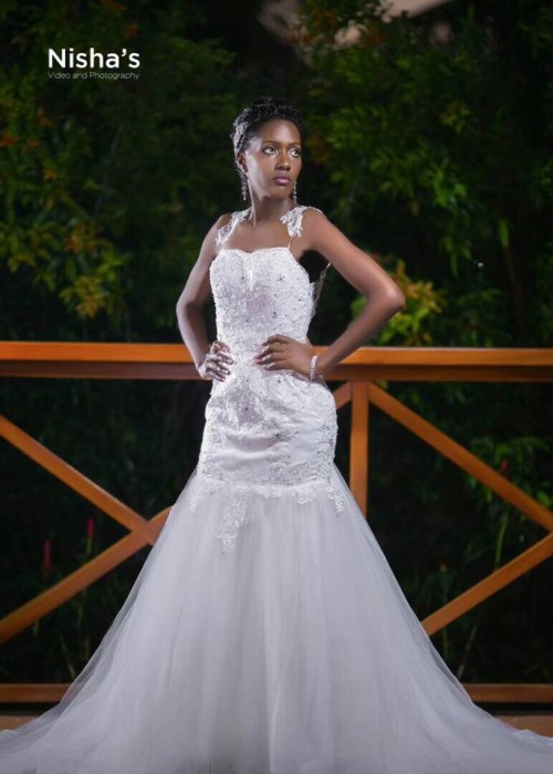 A bride clad in a strap fitting mermaid wedding gown from Nisha's Bridal