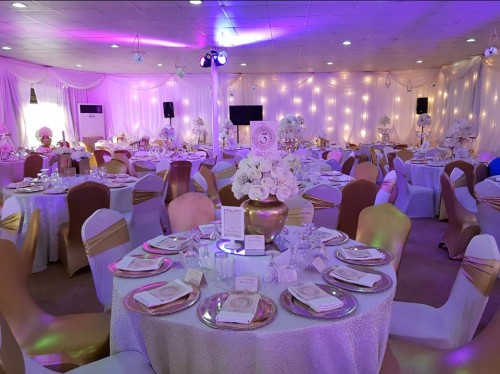 Gold and white wedding decorations at Rivonia Suites