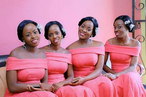 Bridesmaids in off shoulder red outfits from Bridal Lounge Kampala