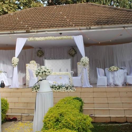 High table wedding decorations at Emerald Hotel Kampala