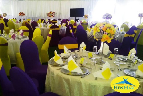 Purple and yellow themed decorations by Henhar Service