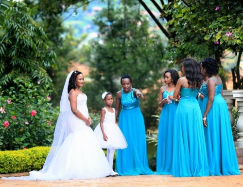 A beautiful bride with her entourage during a wedding photo shoot with MultiWays Photography
