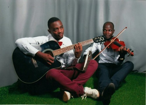 Lead violinist Allan Watson Waswa and lead guitarist in Acoustic, solo and Bass Tayebwa David