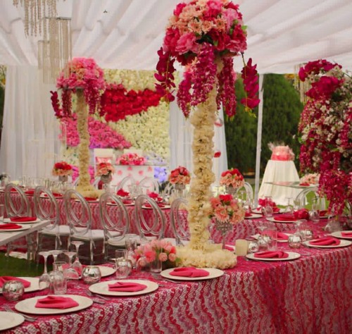 Red inspired wedding decorations with chiavari chairs
