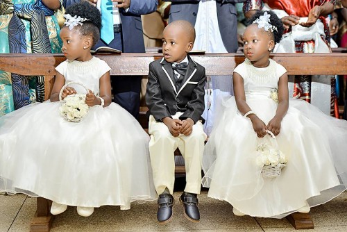 A pair of flower girls and a page boy at a wedding
