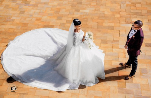 A bride and groom during a wedding photo shoot at Speke Resort Munyonyo