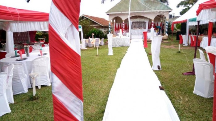 Red & white wedding decorations at Paya Gardens Nakulabye