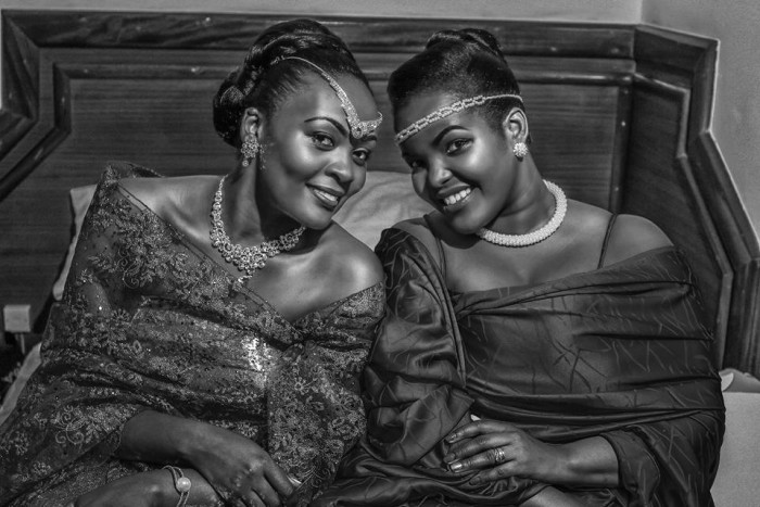 A bride and her maid of honour at a customary wedding covered by Genius Media Events