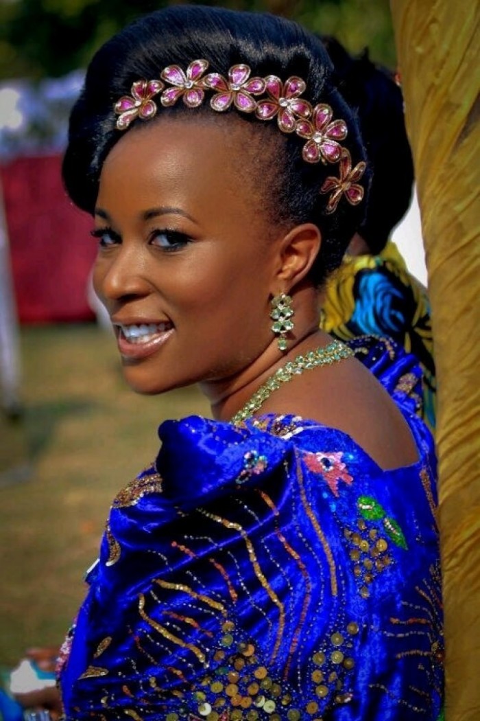 A beautiful bride in a blue gomesi, Makeup & hairdo by Salon Lords & Ladys