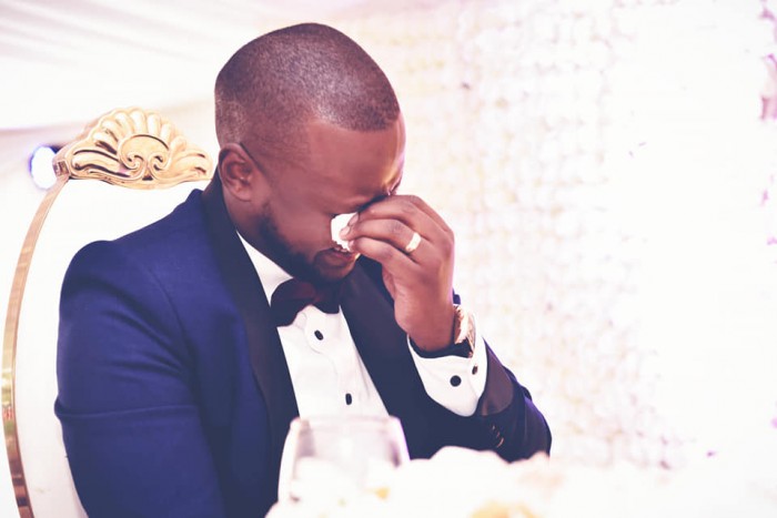 A groom shades tears of joy at his wedding, shots by Zebra Image International Digital Studio