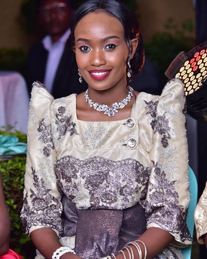 Dorah dressed in an exquisite traditional Kiganda attire (Gomesi)