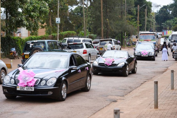 A fleet of bridal cars drive through the streets of Kampala, photo by Ksan Events