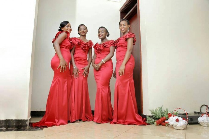 Bridesmaids clad in nice red dresses from Peponi Clothings