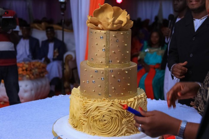 Rhemiel Ray's gold inspired customary wedding cake from Sarahs Cakes