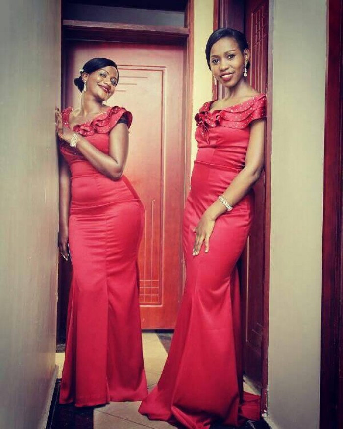 Pesh Koby's bridesmaids slaying in winered offshoulder gowns designed by Peponi Clothings