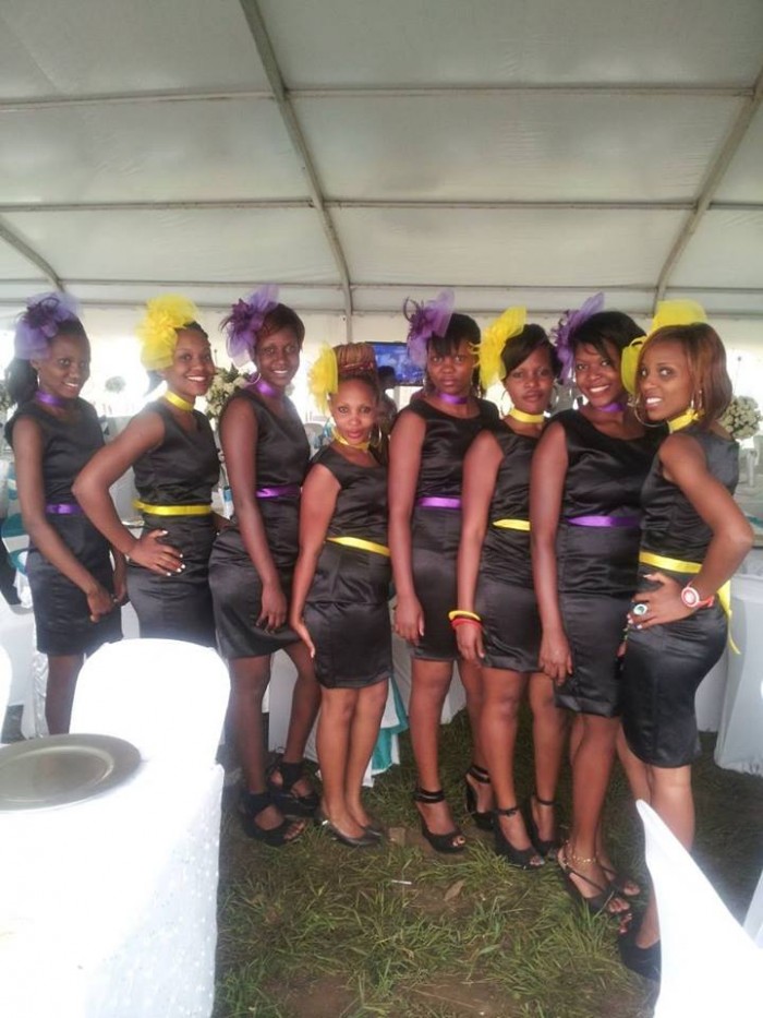Beautiful ushers cloaked in black dresses from Dotaz Ushering Services