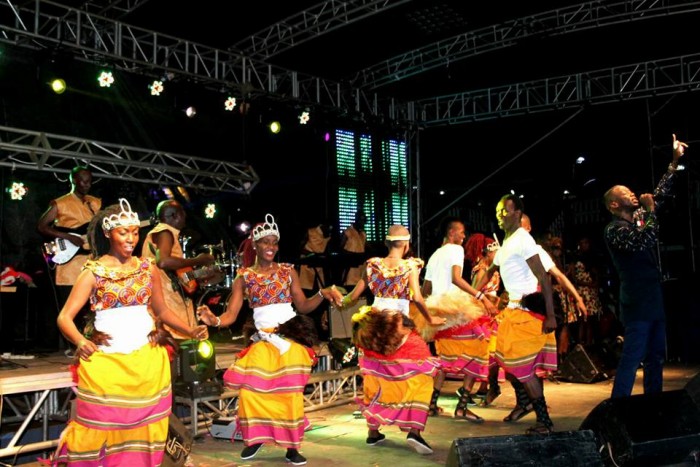 The Dance N' Beats Cultural Troupe dance as Meseach Ssemakula performs at his concert
