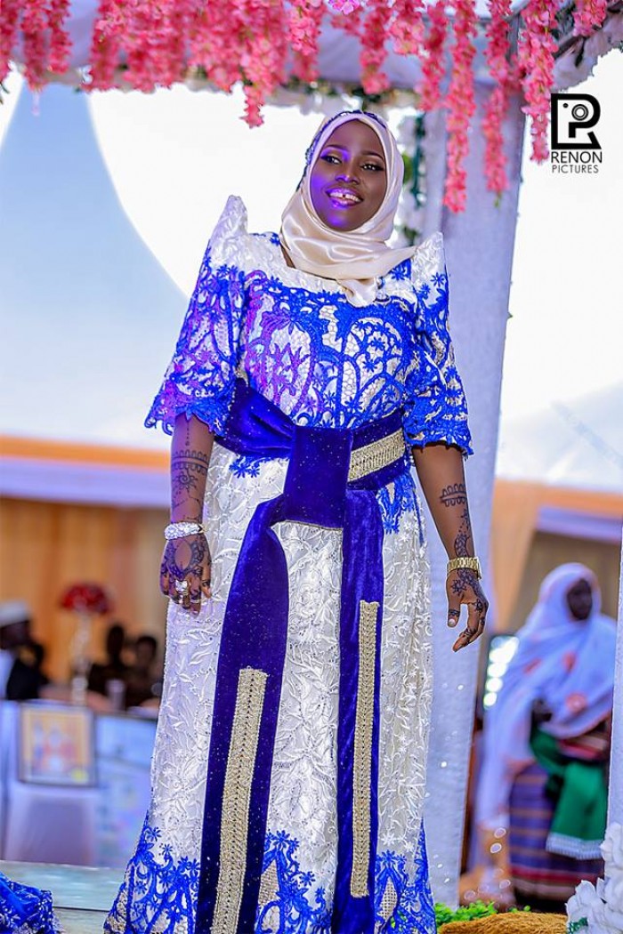 A smart Nabiirah smiles during her traditional wedding with Moustapher