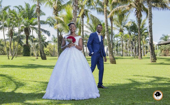 A bride and groom at wedding photo shoot with Ken's shot Photography at Munyonyo