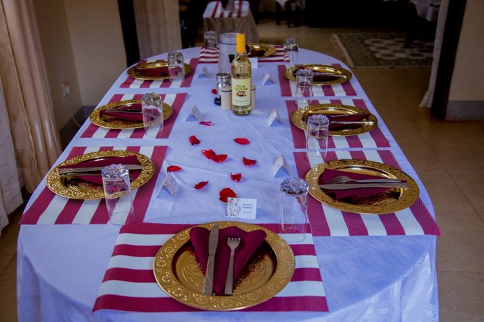 Gold charger plates and table decorations by Blessed HANDS DECOR Services