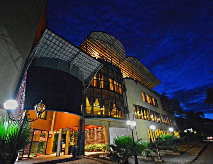 A night outside view of Mackinnon Suites