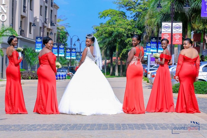 Prossy & her maids clad in red dresses