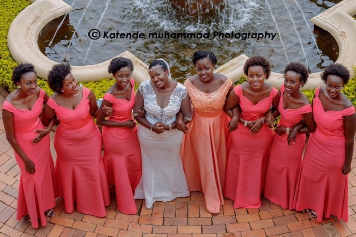 Shellar and her bridesmaids clad in red dresses