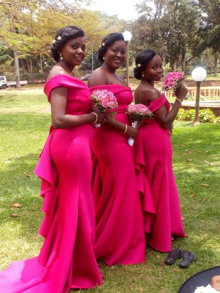 Bridesmaids in beautiful red tailored dresses from Bridal Lounge Kampala