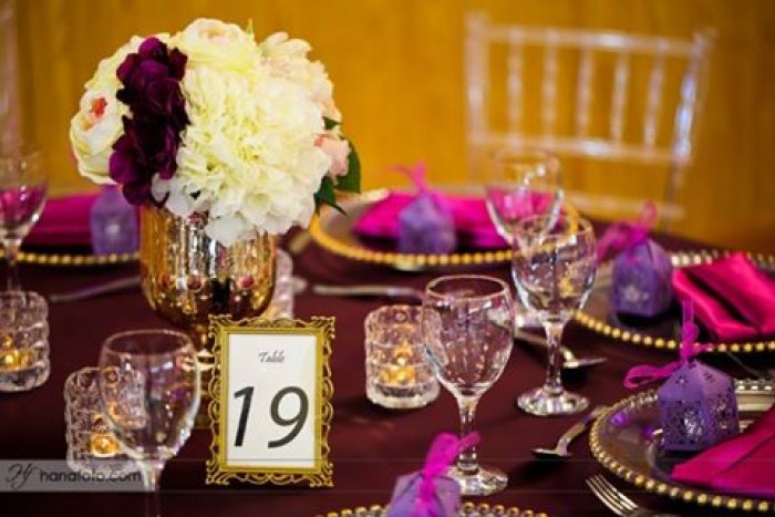 Beautiful purple and gold inspired event decorations by Mugagga Events
