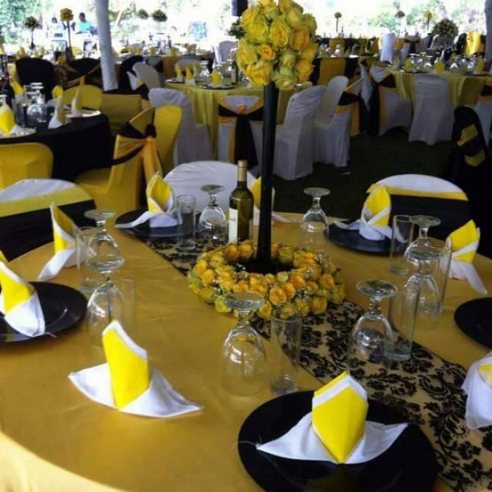 Yellow, black & gold themed wedding decorations at Paya Gardens Nakulabye