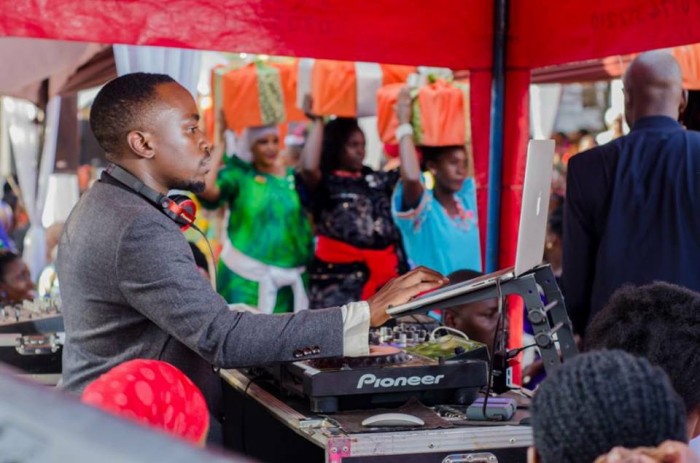 Dj Moustey Mustapha on the turntables at an introduction ceremony, Music by Real Sounds