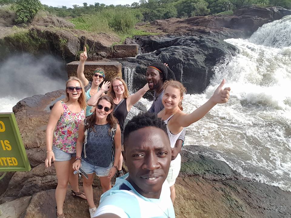 Tourist cheer in excitement during their trip to the Pearl of Africa