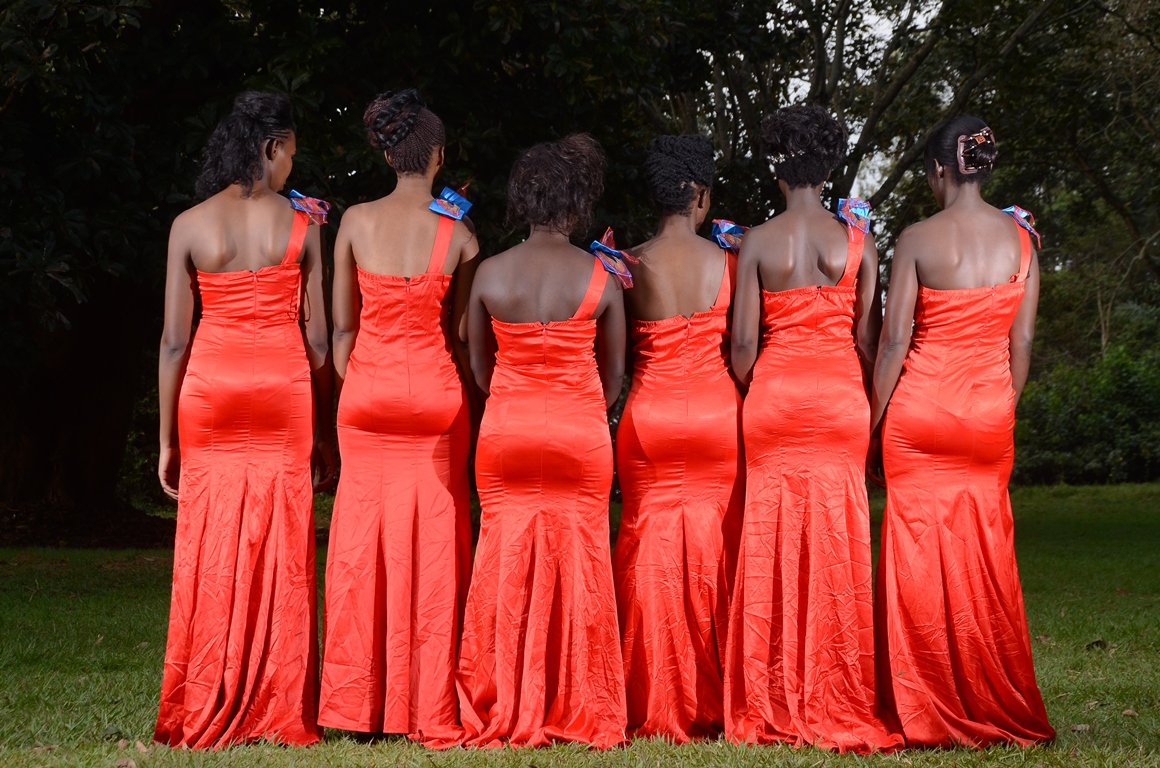 Models in red bridesmaids dresses by Lady Scarlet Bridals