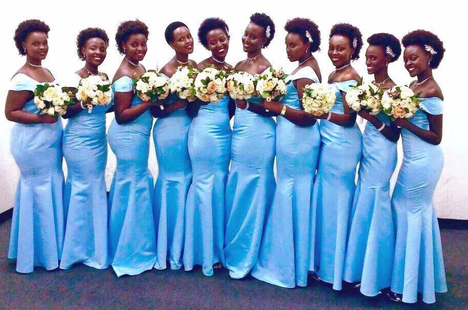 Bridesmaids in tailored outfits by Nisha's Bridals