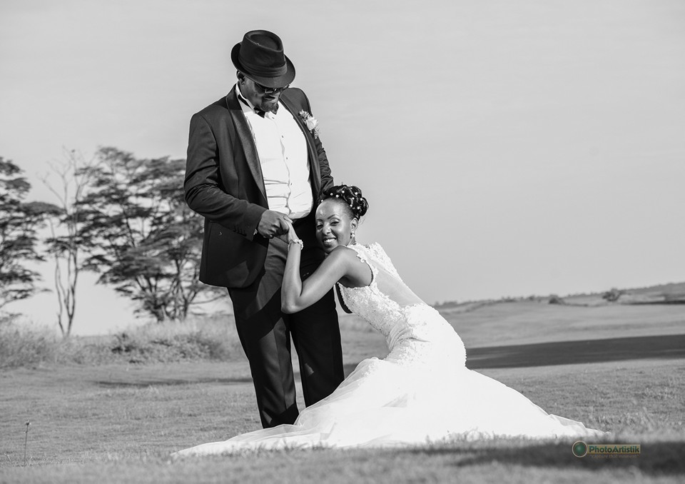 A bride and groom at a wedding photo shoot by Photo Artistik