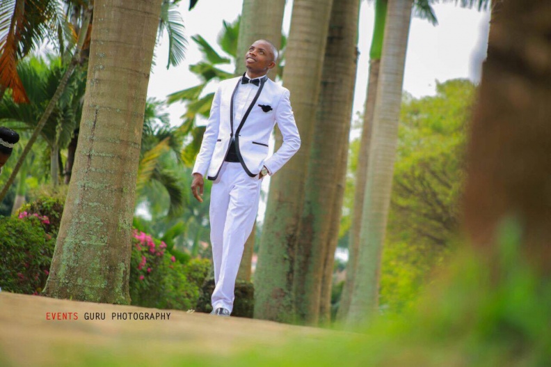 Bod in a white suit on his wedding day as captured by Events Guru Photography