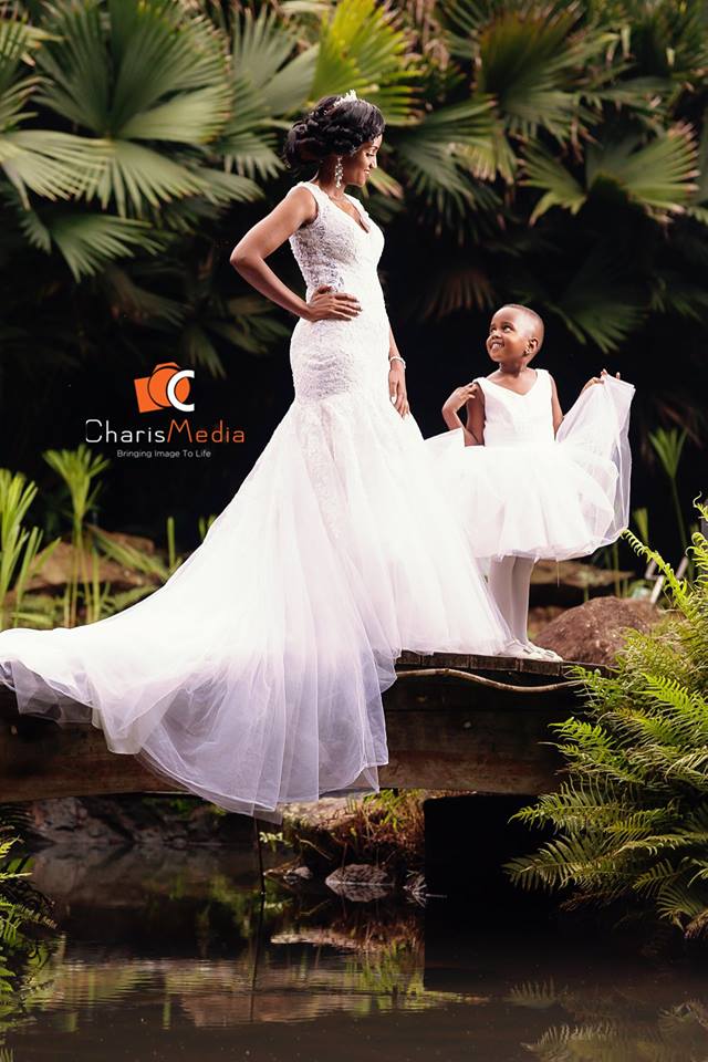 A bride and her flower girl, wedding photo shoot at Speke Resort Munyonyo