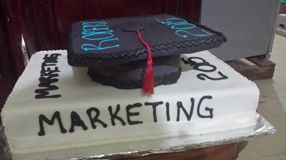 A graduation cake baked by New Day Bakery & Catering Services
